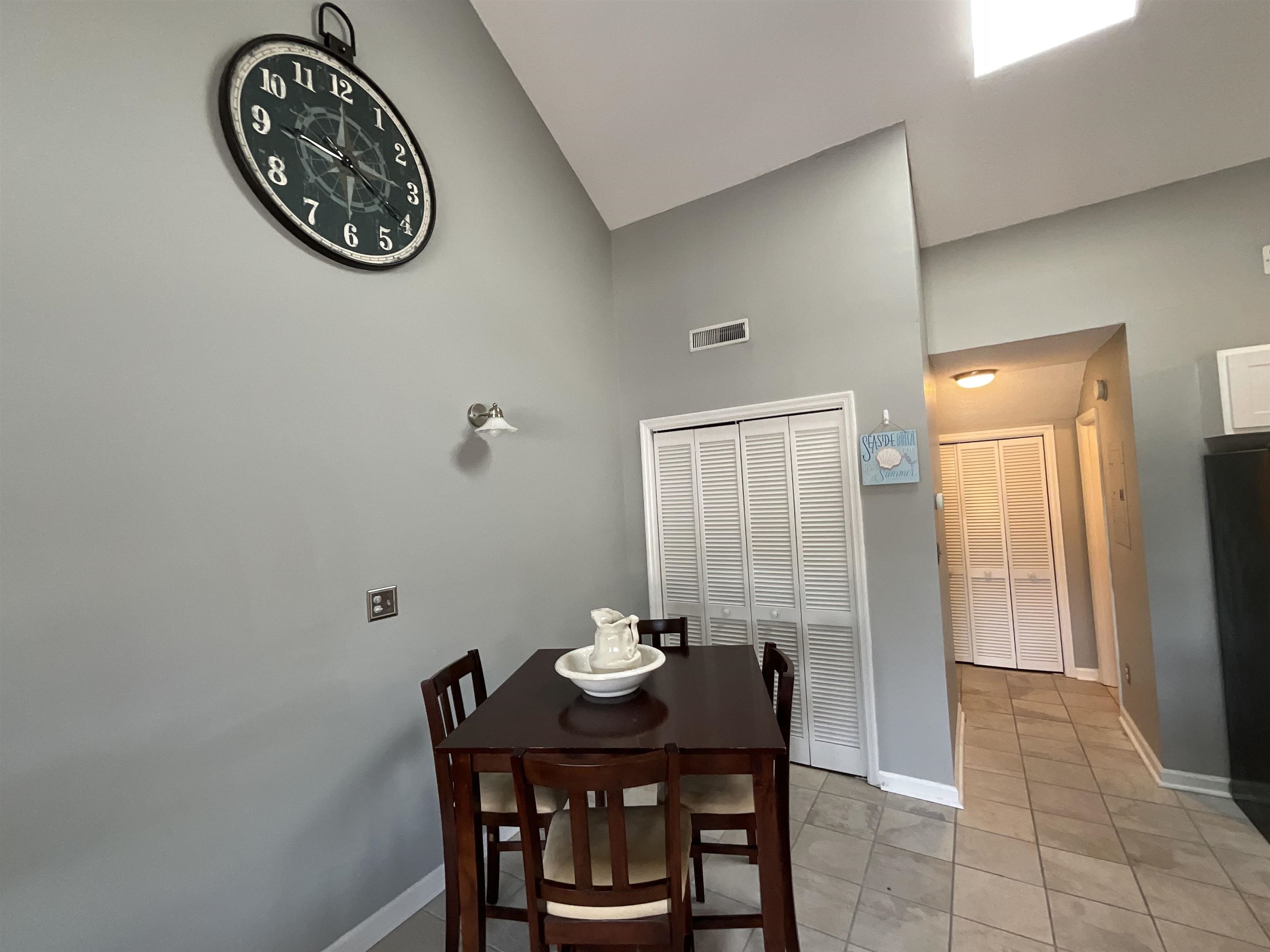 1880 Colony Drive, Unit 11O Surfside Beach, SC 29575 - Photo 6 of 17 Dining space featuring light tile patterned floors and high vaulted ceiling