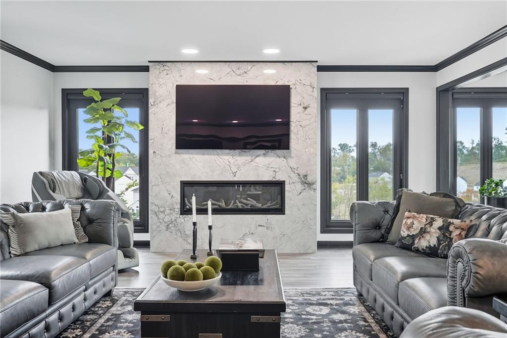 2460 Nicholson Road Sewickley, PA 15143 - Photo 13 of 50 a living room with furniture a flat screen tv and a fireplace