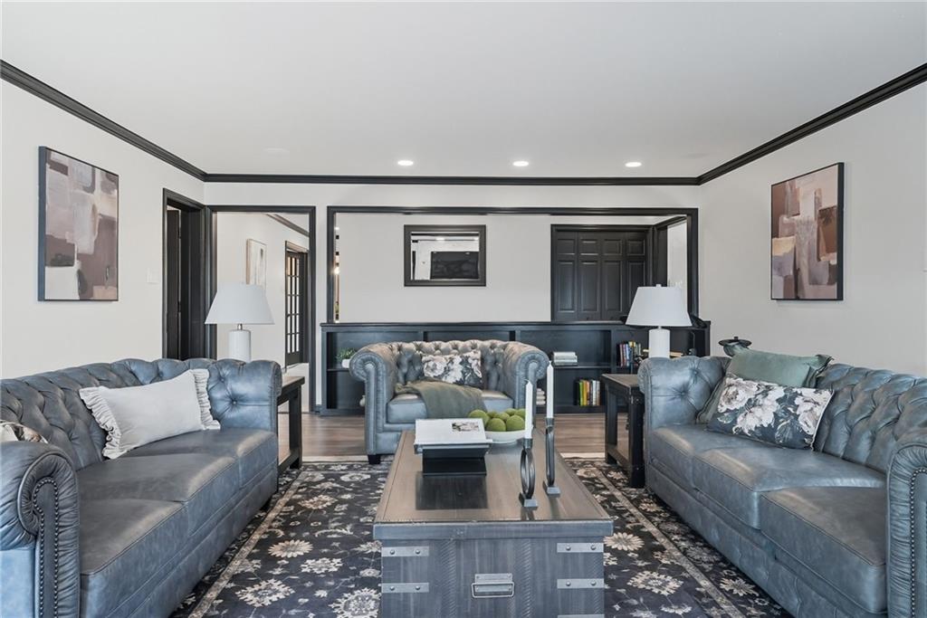2460 Nicholson Road Sewickley, PA 15143 - Photo 15 of 50 a living room with furniture and a fireplace