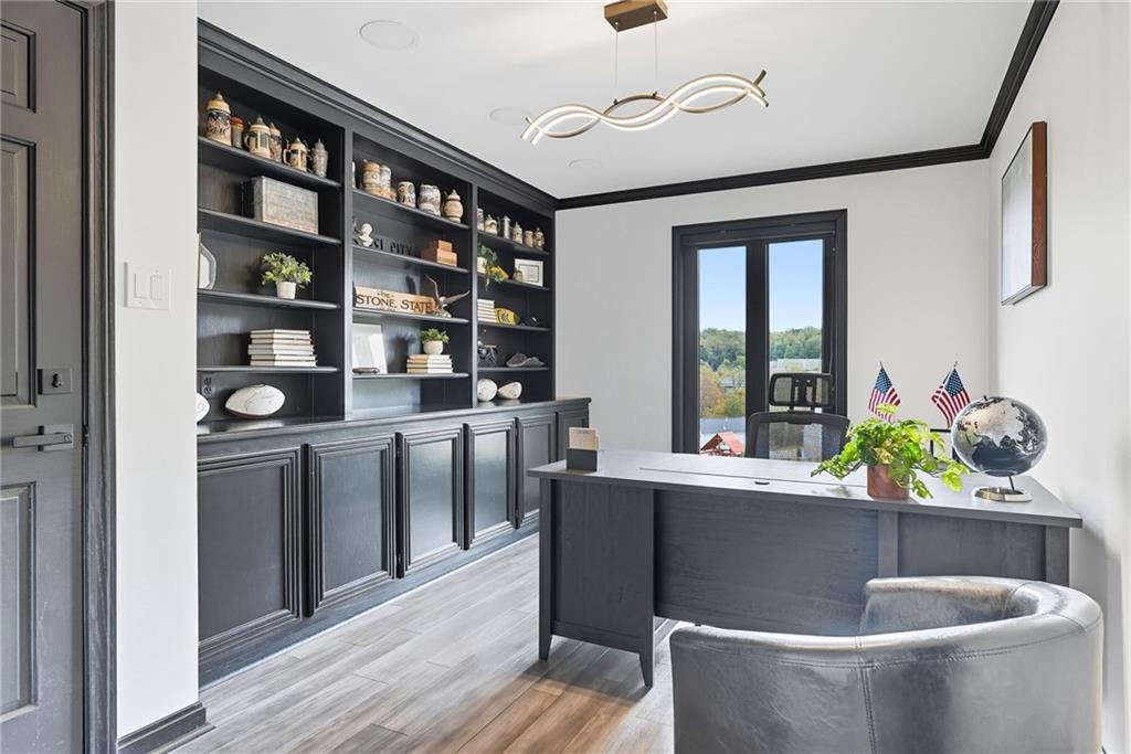 2460 Nicholson Road Sewickley, PA 15143 - Photo 18 of 50 a room with stainless steel appliances kitchen island granite countertop a table chairs in it and wooden floors