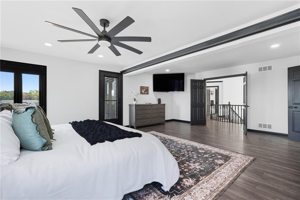 2460 Nicholson Road Sewickley, PA 15143 - Photo 21 of 50 a bedroom with a bed and wooden floor