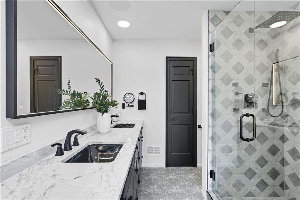 2460 Nicholson Road Sewickley, PA 15143 - Photo 27 of 50 a bathroom with a sink a mirror and shower