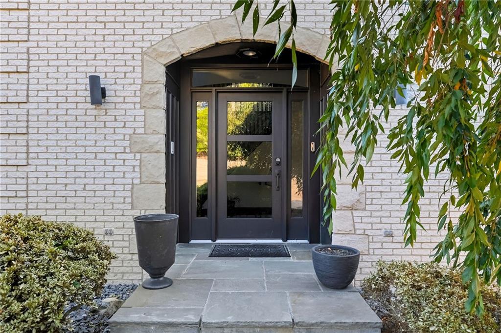 2460 Nicholson Road Sewickley, PA 15143 - Photo 3 of 50 a front view of a house with a potted plant
