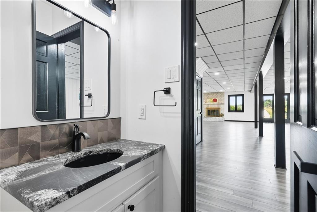 2460 Nicholson Road Sewickley, PA 15143 - Photo 36 of 50 a bathroom with a sink and mirror