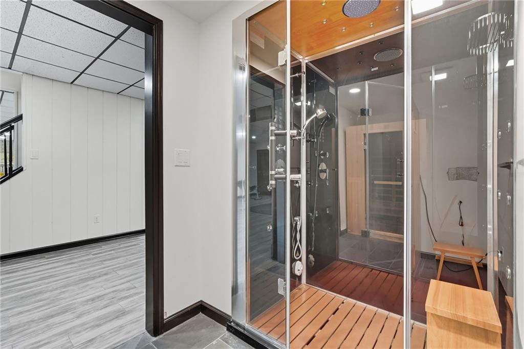 2460 Nicholson Road Sewickley, PA 15143 - Photo 38 of 50 a bathroom with a glass shower door