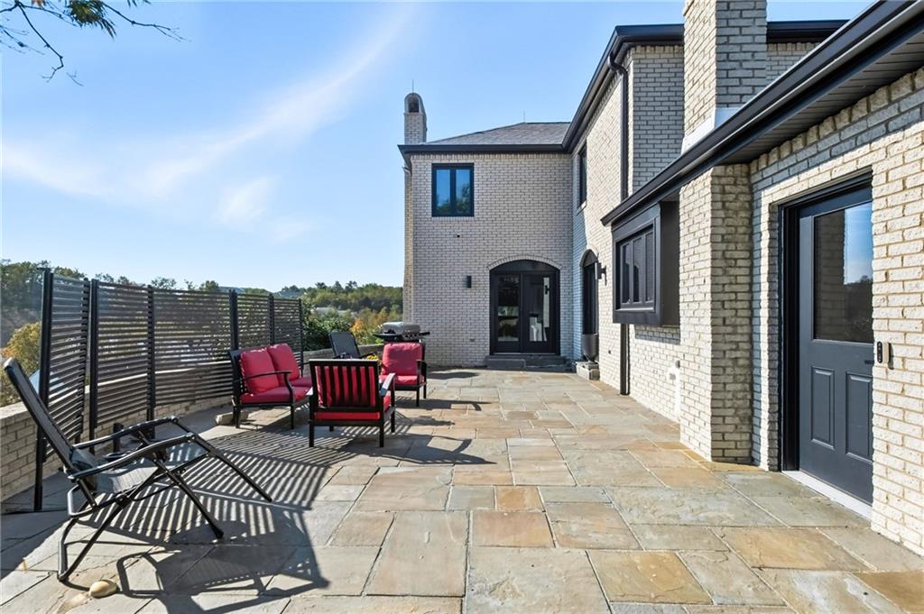 2460 Nicholson Road Sewickley, PA 15143 - Photo 40 of 50 a view of a patio with couches chairs and potted plants