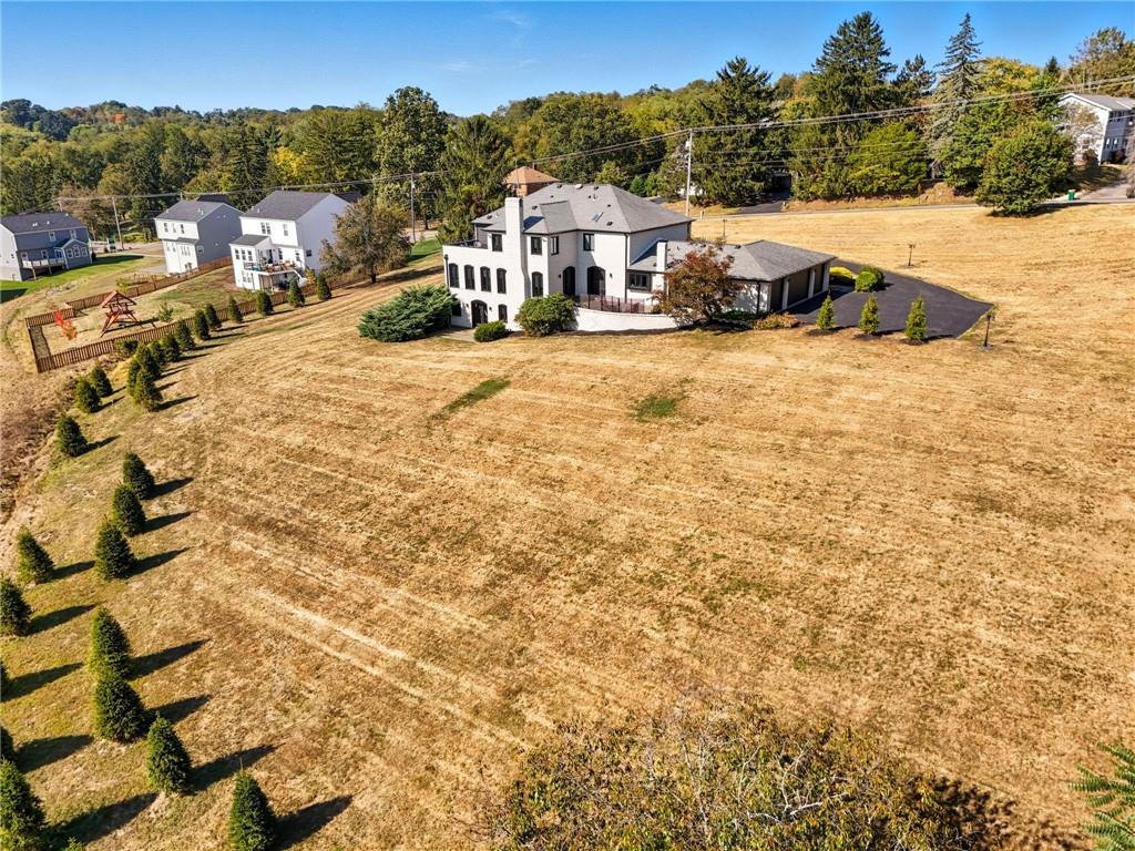 2460 Nicholson Road Sewickley, PA 15143 - Photo 47 of 50 a view of residential houses with yard and mountain view in back