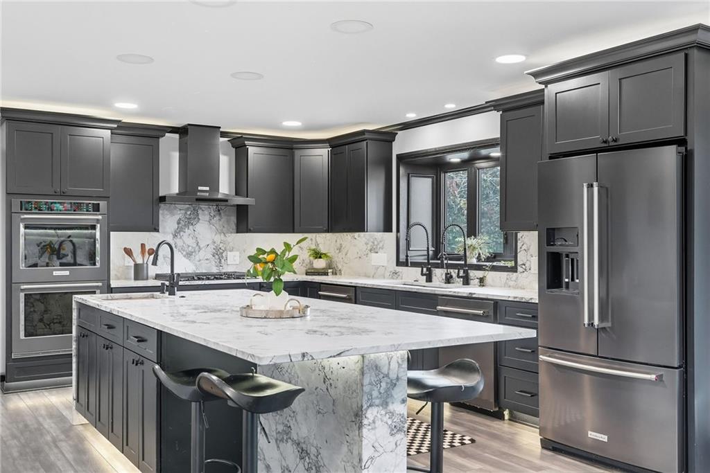 2460 Nicholson Road Sewickley, PA 15143 - Photo 7 of 50 a kitchen with granite countertop a sink appliances and cabinets