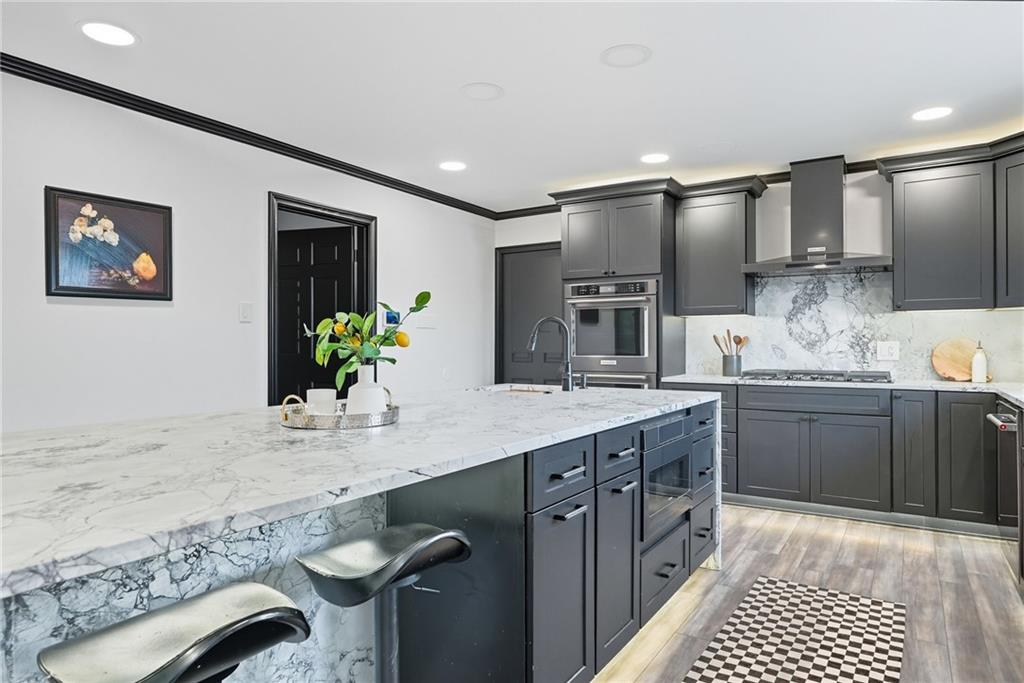 2460 Nicholson Road Sewickley, PA 15143 - Photo 9 of 50 a kitchen with granite countertop a sink stainless steel appliances and cabinets