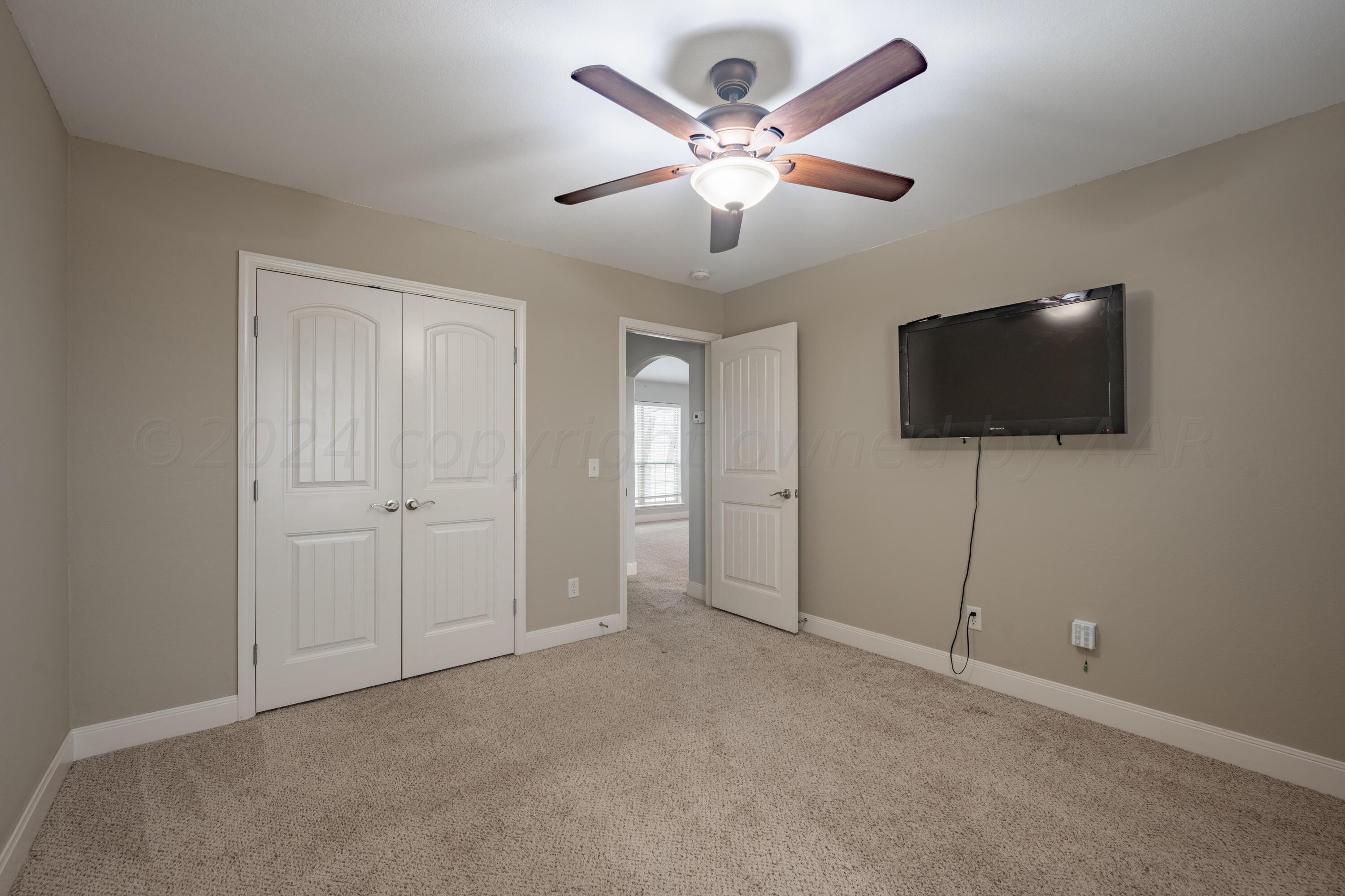 4512 Ross Street Amarillo, TX 79118 - Photo 15 of 24 a view of a livingroom with a flat screen tv