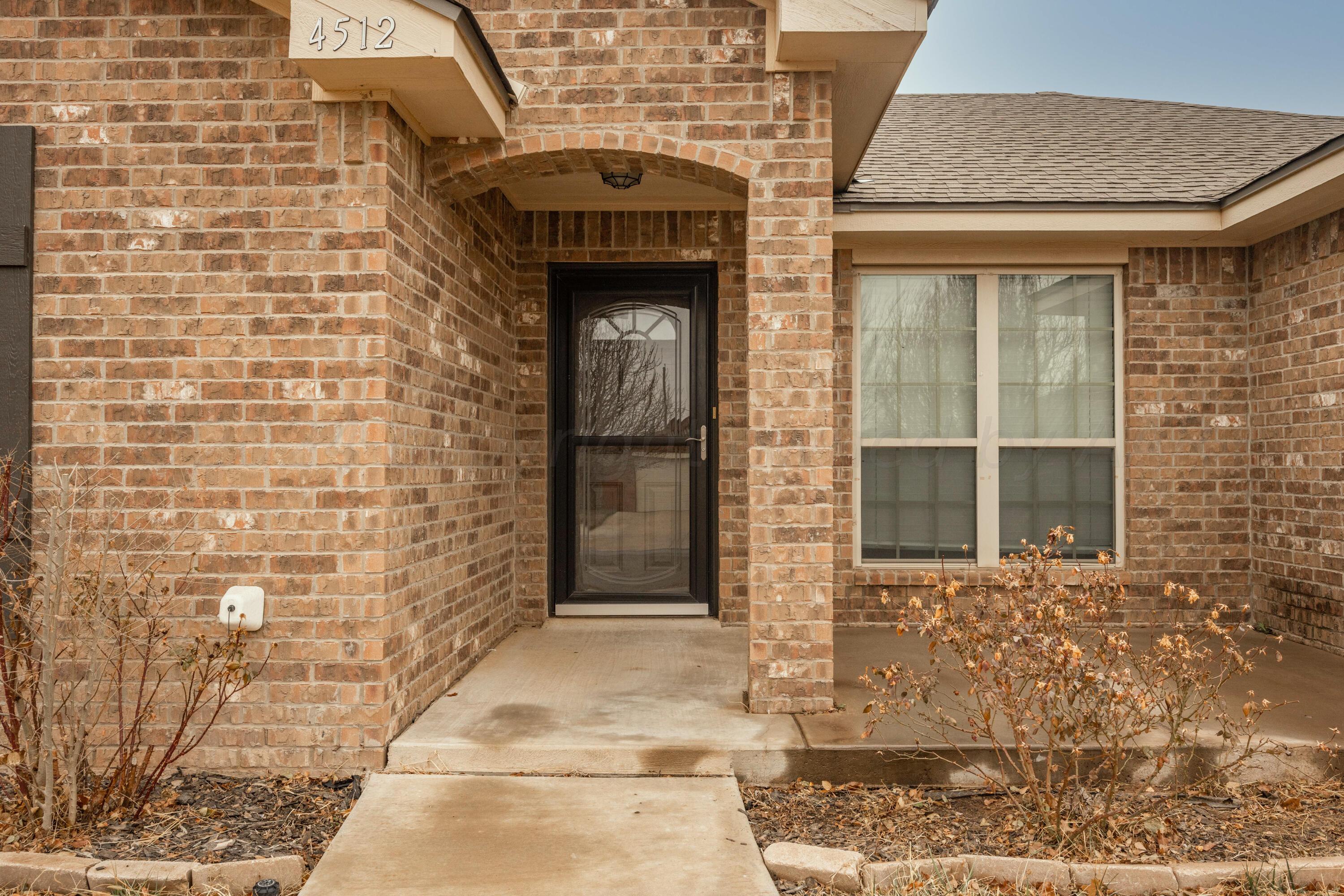 4512 Ross Street Amarillo, TX 79118 - Photo 2 of 24 a front view of a building with a shower