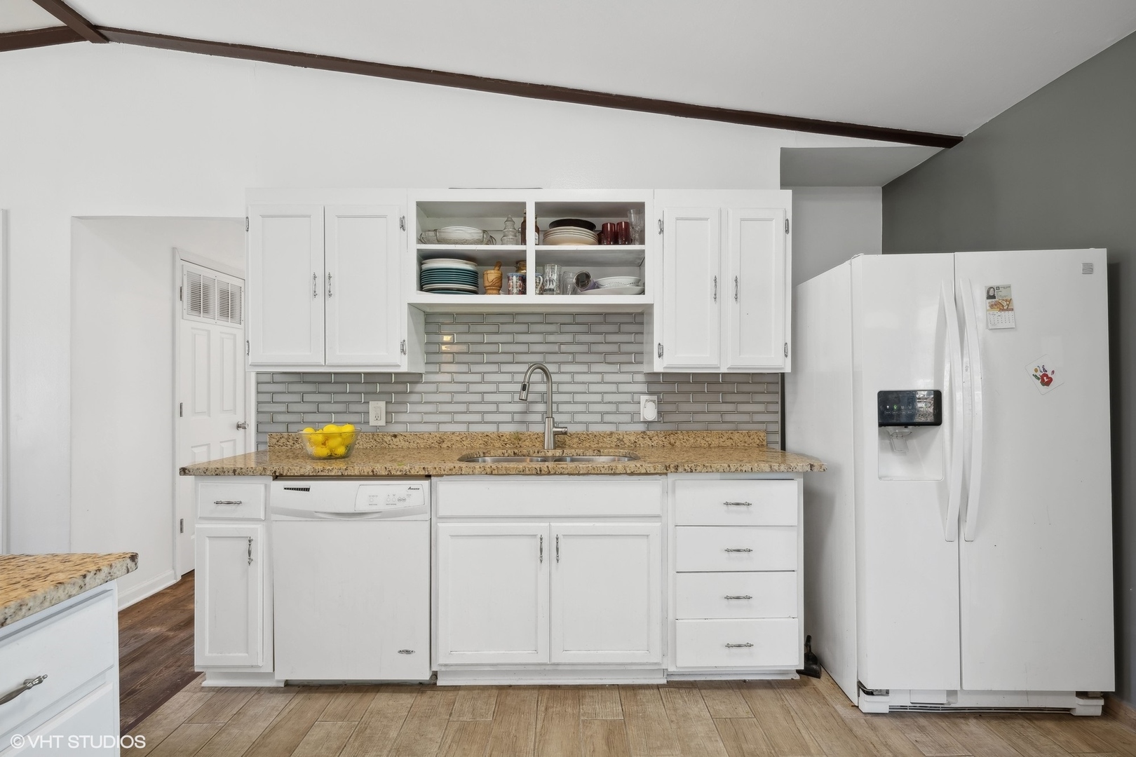 812 Sumac Drive Streamwood, IL 60107 - Photo 6 of 16 a kitchen with white cabinets and white appliances