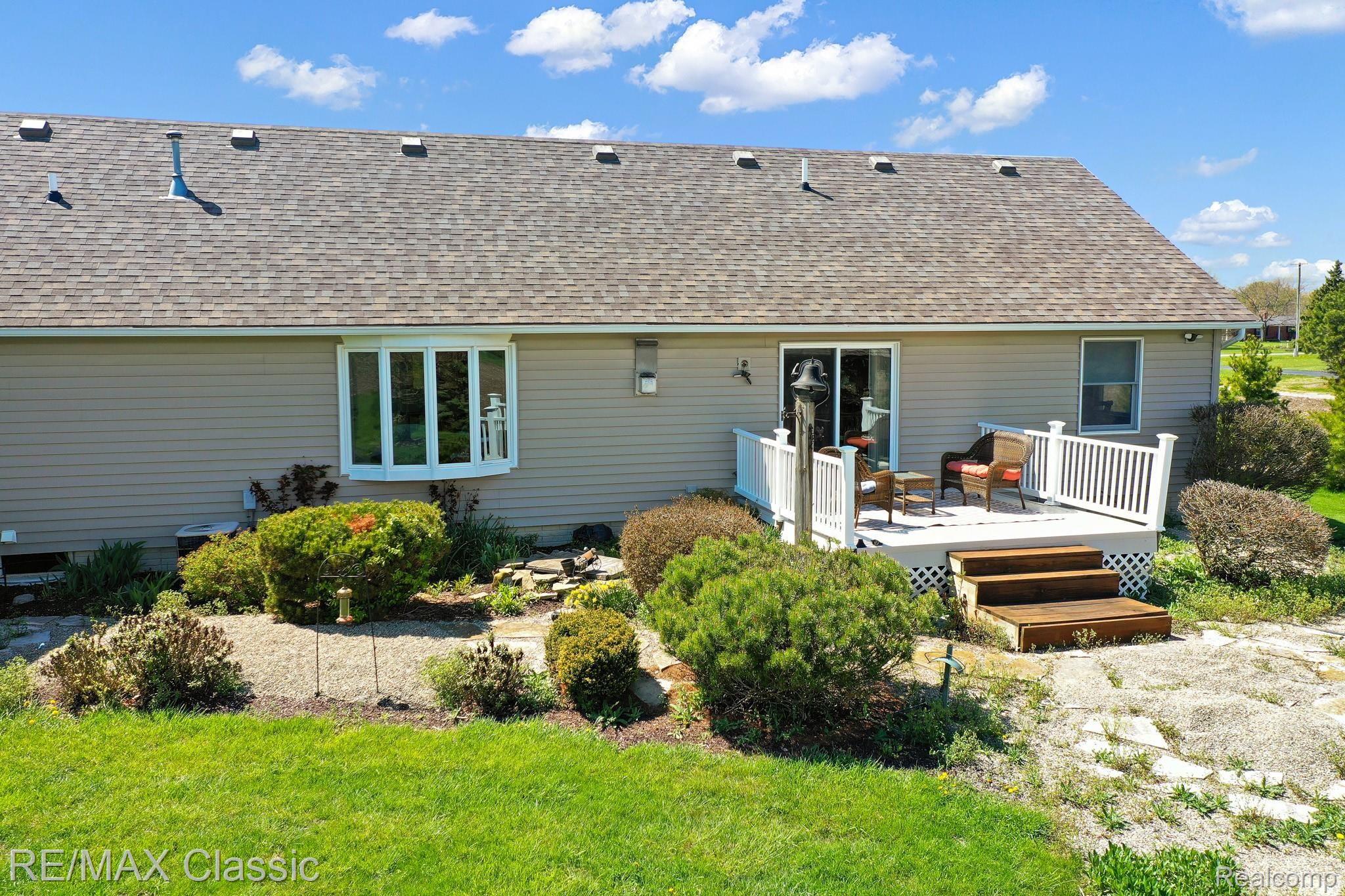 8530 Chinavare Road Newport, MI 48166 - Photo 9 of 34 Enjoy the Back Yard Deck from Dining Area Door Wall