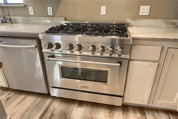 a bedroom with a bed and a lamp