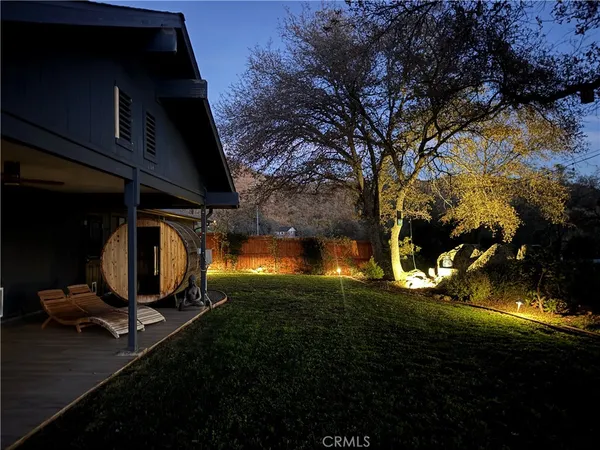 a view of a backyard of the house