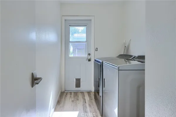a view of backyard and utility room