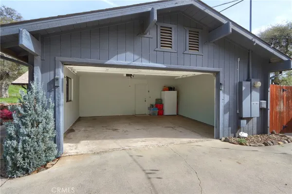 a view of a house with garden and porch