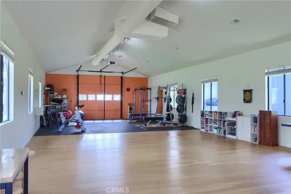 a view of a house with backyard porch and sitting area