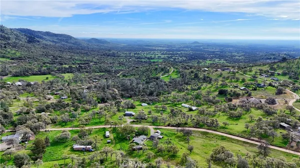 a view of a yard with a mountain