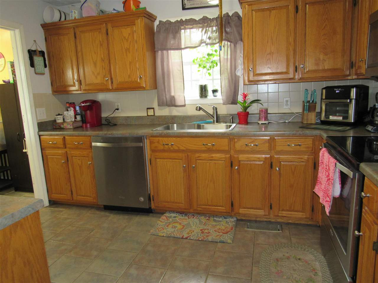 988 Franklin Store Road Lexington, TN 38351 - Photo 4 of 19 a kitchen with stainless steel appliances granite countertop a sink stove and cabinets