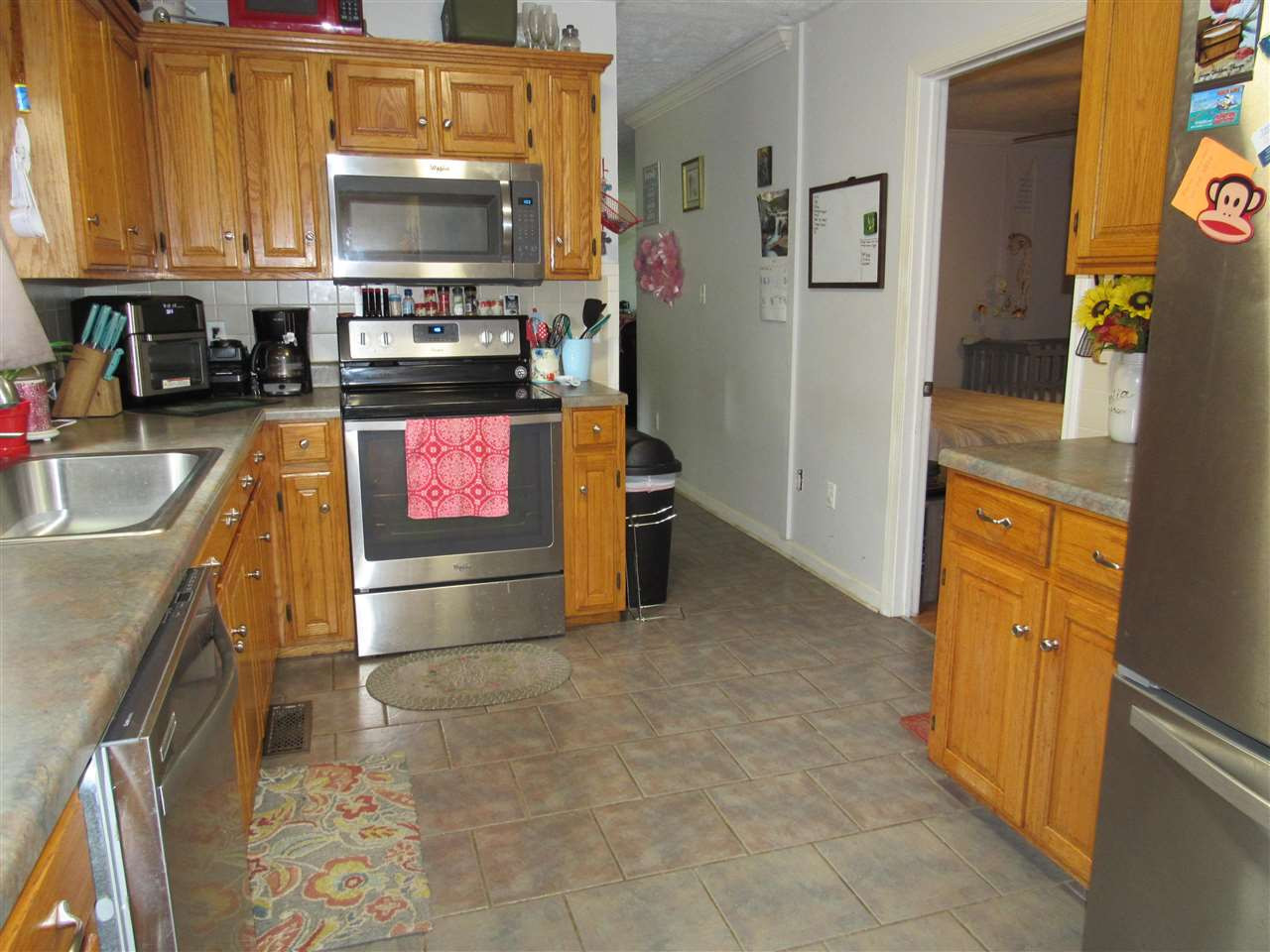 988 Franklin Store Road Lexington, TN 38351 - Photo 5 of 19 a kitchen with granite countertop a sink stove and cabinets