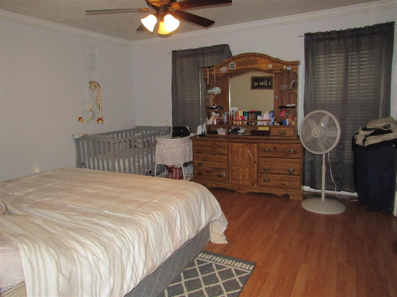 988 Franklin Store Road Lexington, TN 38351 - Photo 8 of 19 a bedroom with a bed and a mirror