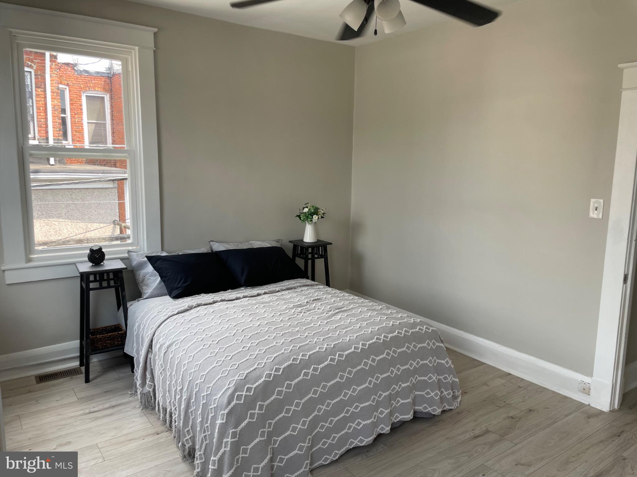 2301 Mosher Street Baltimore, MD 21216 - Photo 15 of 30 a bedroom with a bed and a window