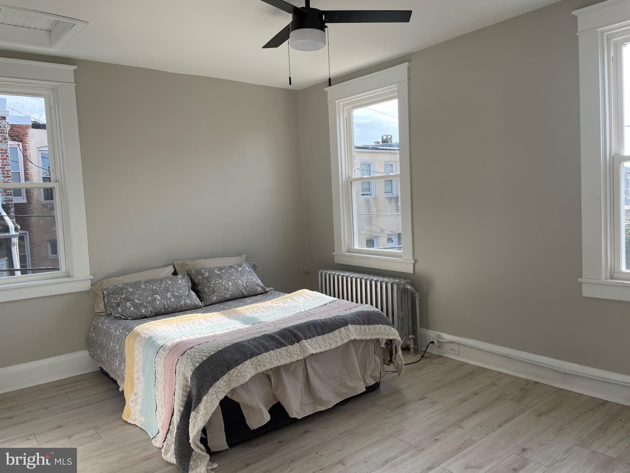 2301 Mosher Street Baltimore, MD 21216 - Photo 18 of 30 a bedroom with a bed and a window