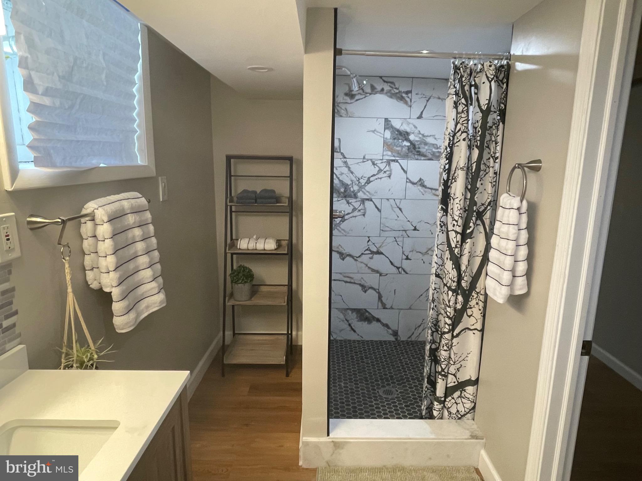 2301 Mosher Street Baltimore, MD 21216 - Photo 21 of 30 a bathroom with a toilet and shower