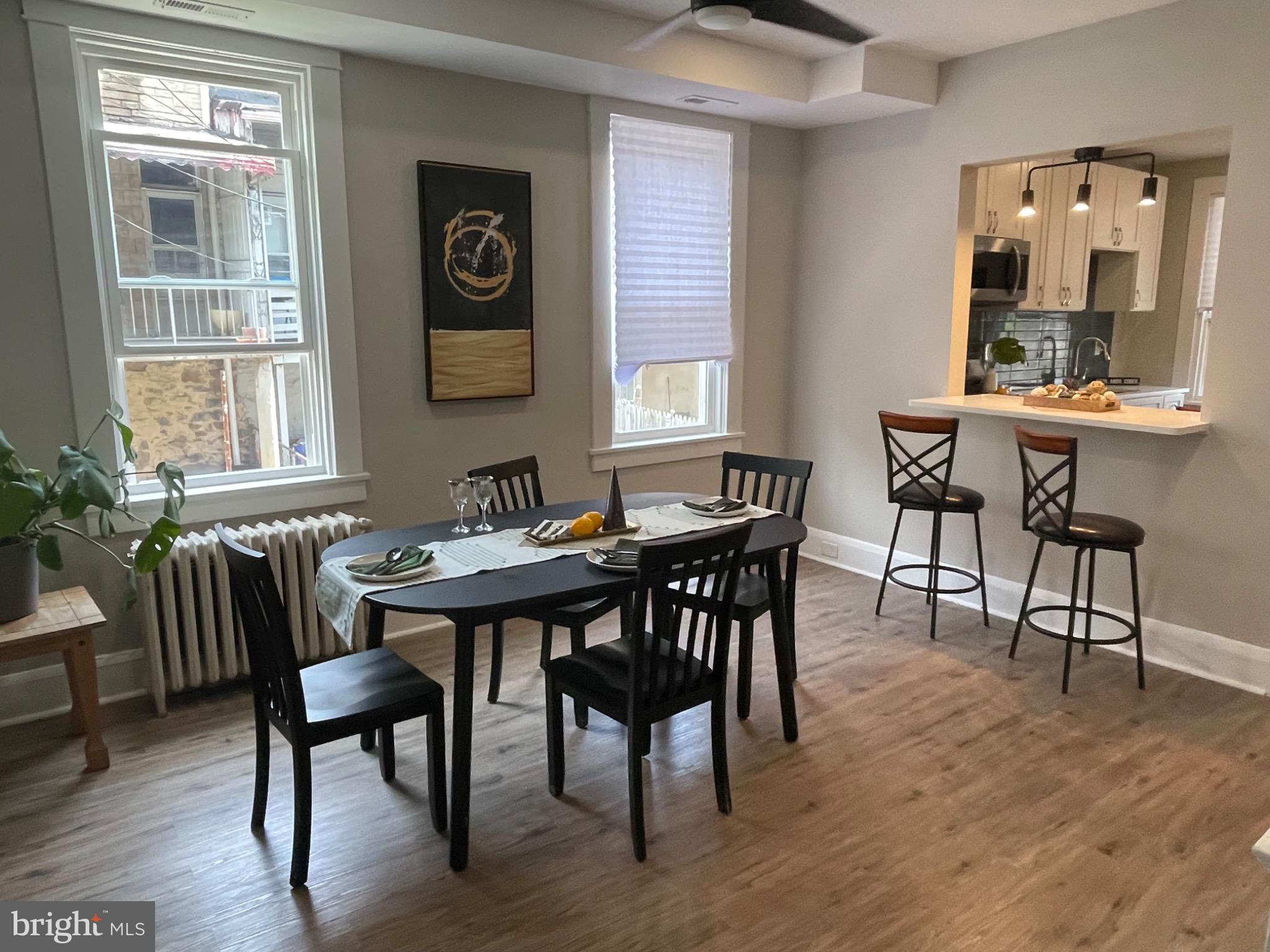 2301 Mosher Street Baltimore, MD 21216 - Photo 7 of 30 a view of a dining room with furniture and wooden floor