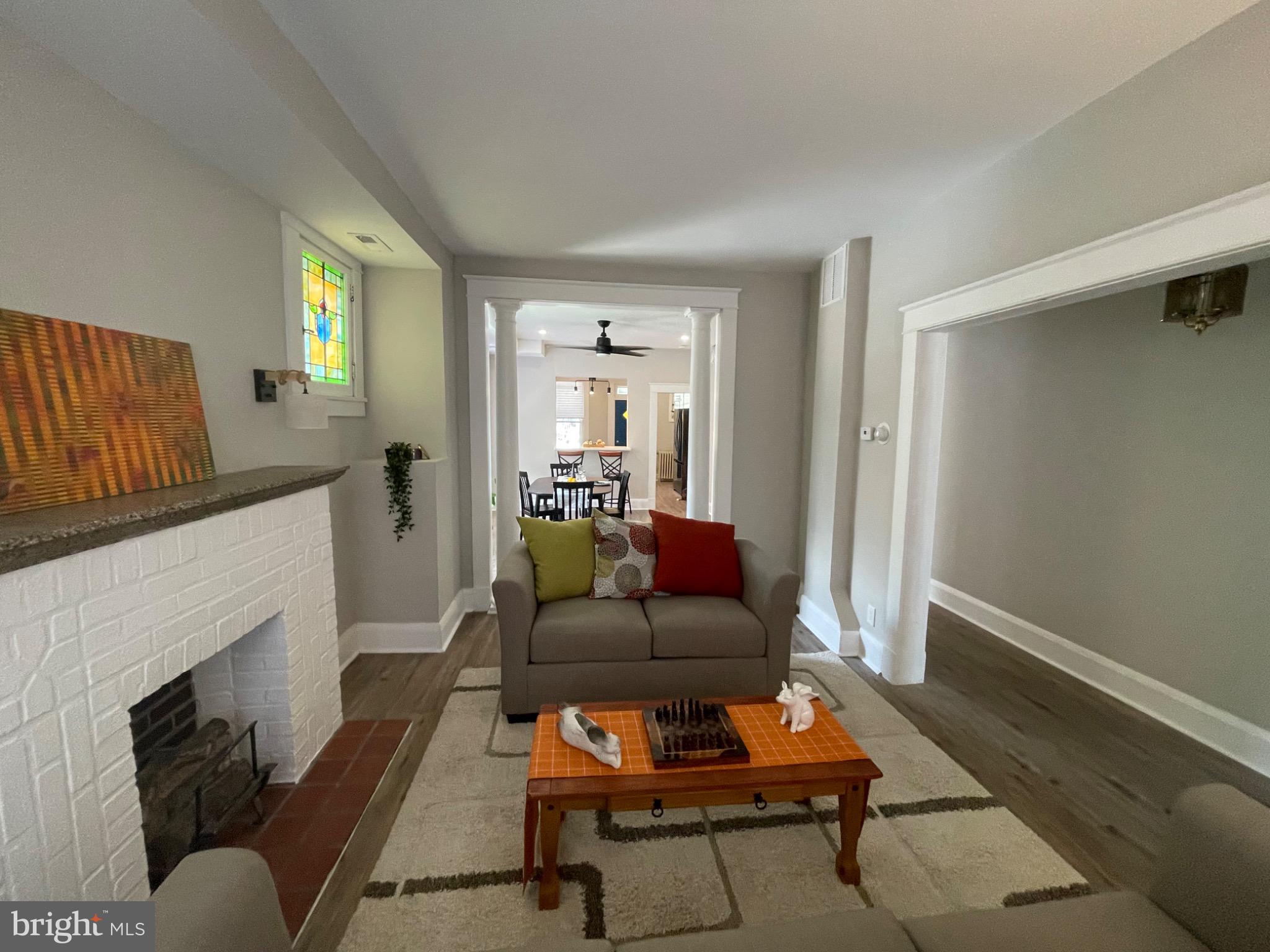 2301 Mosher Street Baltimore, MD 21216 - Photo 10 of 30 a living room with furniture and a fireplace
