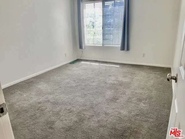 a view of a room that has a window in it