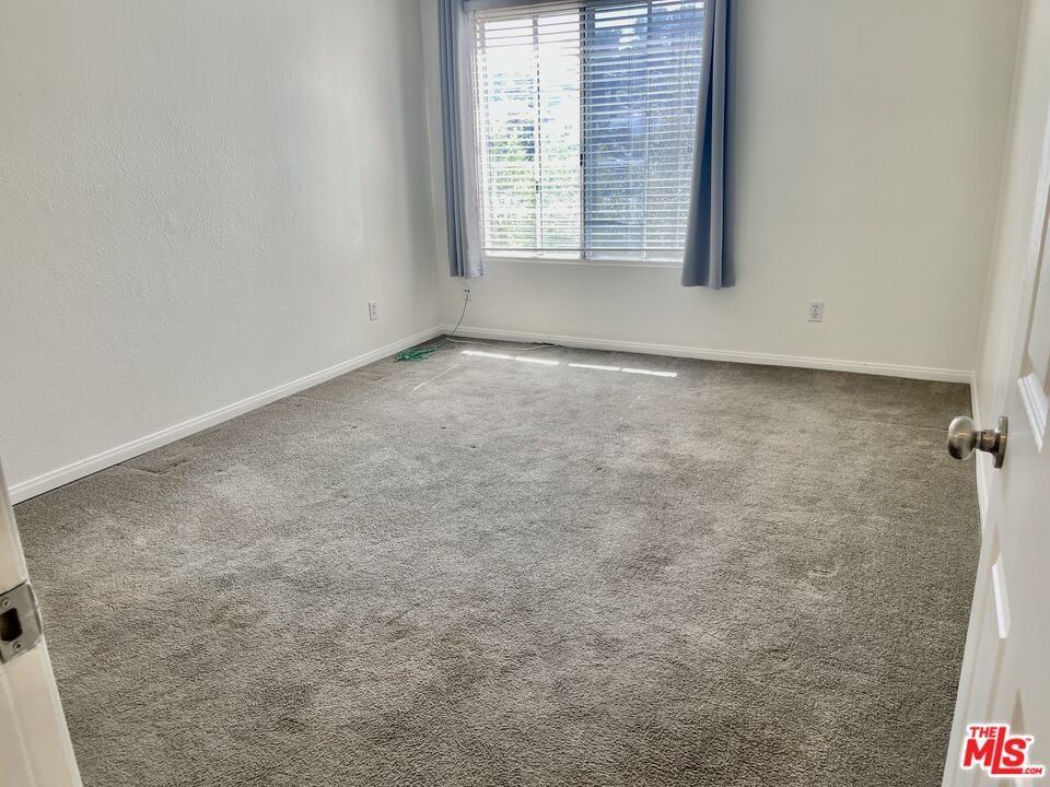 5530 Owensmouth Avenue, Unit 223 Woodland Hills, CA 91367 - Photo 11 of 21 a view of a room that has a window in it