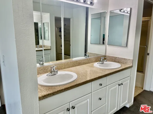 a sink and a mirror in a bathroom