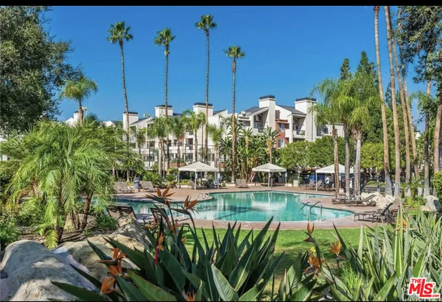 a view of a chairs and table in the patio