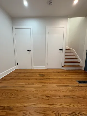 a view of room and wooden floor