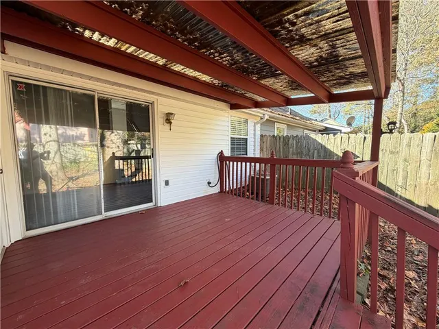 a balcony with wooden floor