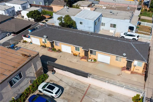 an aerial view of residential houses with outdoor space