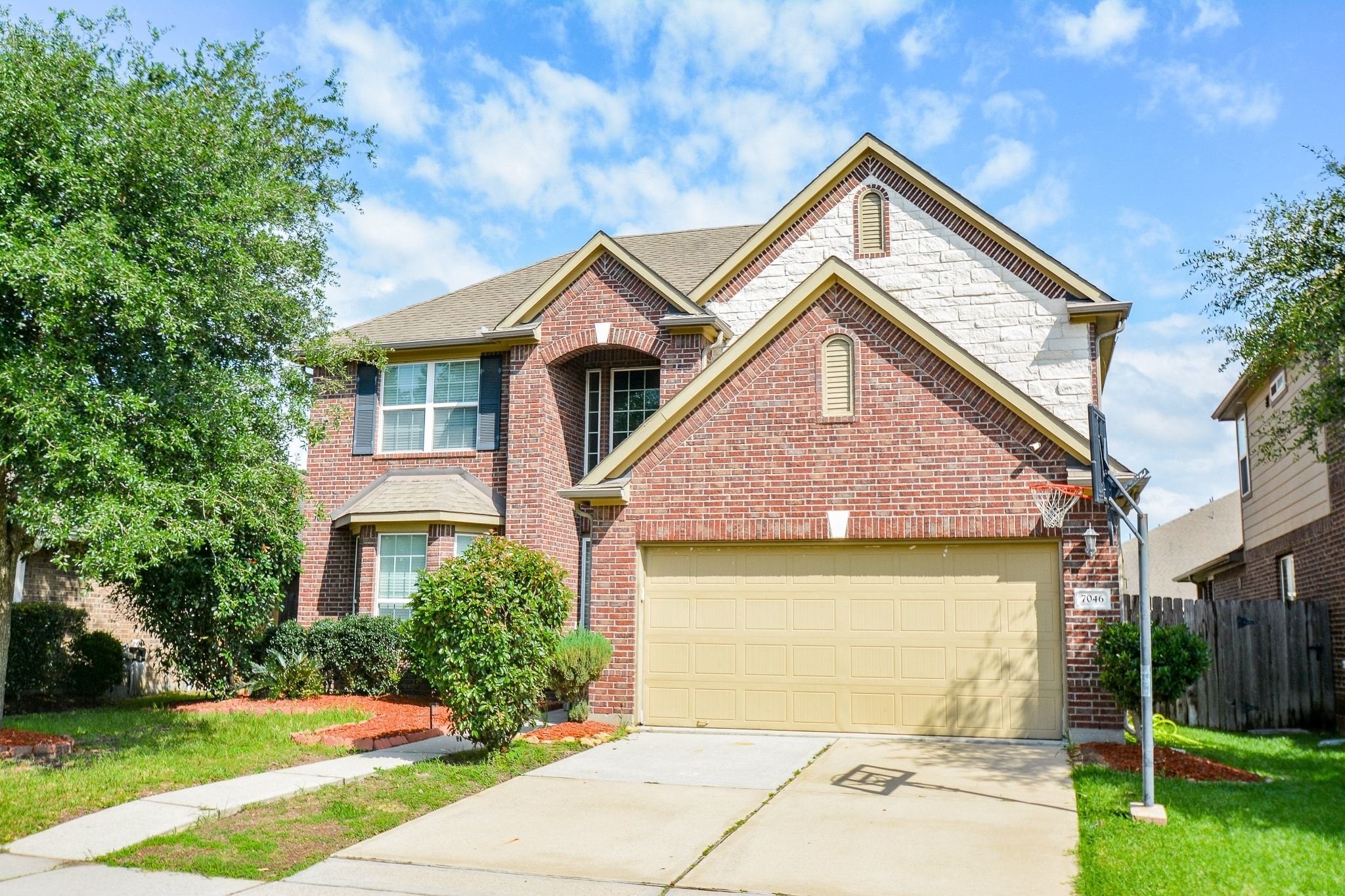 7046 Sliding Rock Circle Spring, TX 77379 - Photo 2 of 41 Charming two-story brick home with a spacious two-car garage and inviting curb appeal, nestled in a serene neighborhood.
