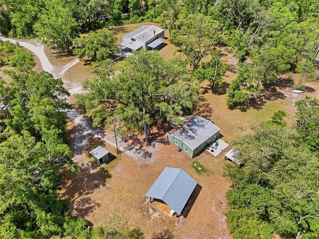 401 Southeast Falcon Road Branford, FL 32008 - Photo 18 of 76 an aerial view of a house with a yard and lake view