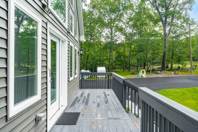 a view of balcony of the house and deck