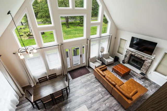 a living room with furniture fireplace and a flat screen tv