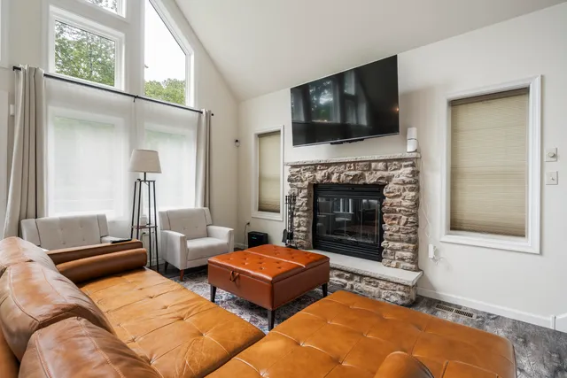 a living room with furniture and a large window