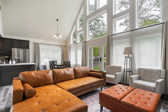 a view of a livingroom with furniture and a flat screen tv