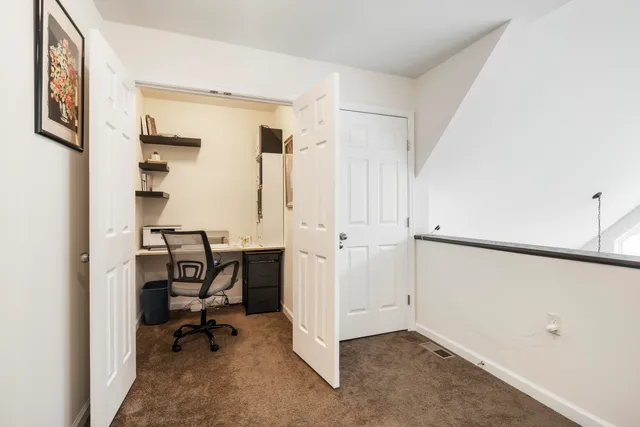 a bedroom with bed couch and window