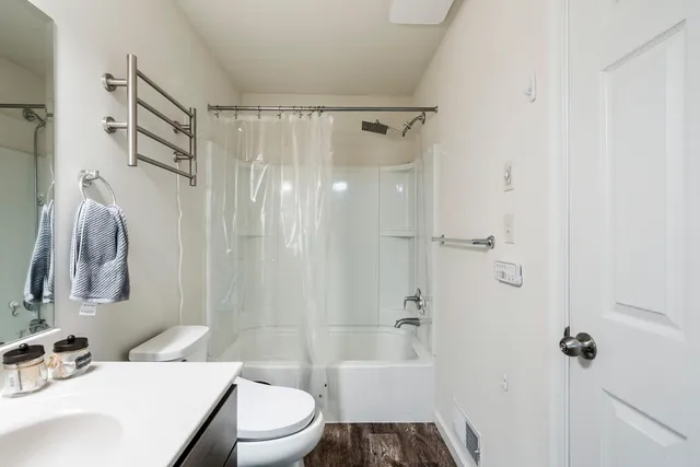 a view of a room with baby crib and cabinet