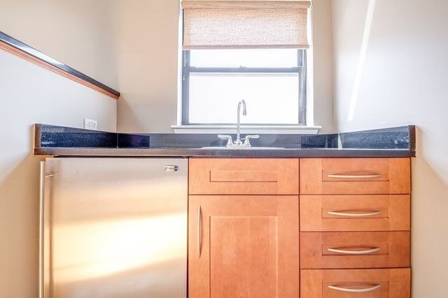 a bathroom with a window and a shower