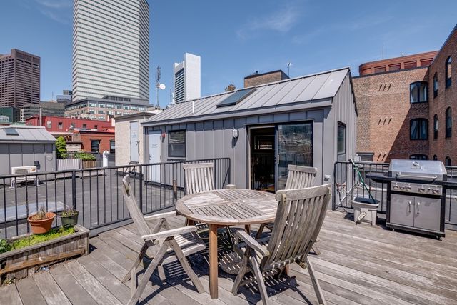 a view of a chairs and table on the deck