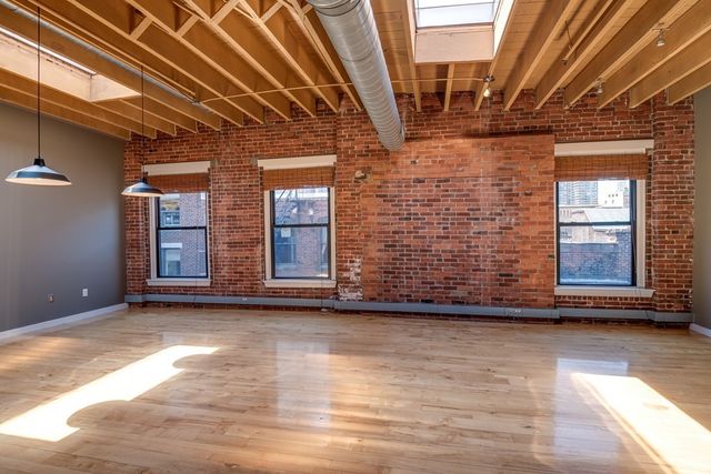 a view of an empty room with windows