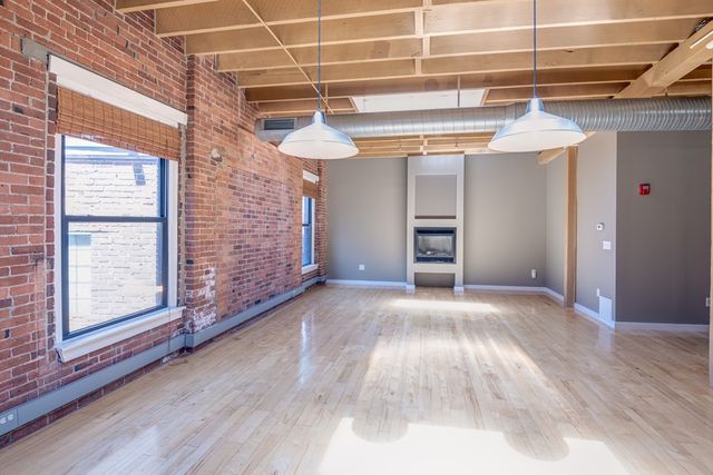 a view of a room with wooden walls and stairs